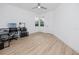 Bright bedroom featuring a work space, with wood flooring and natural light at 3726 Rain Tree Ct, Palm Harbor, FL 34685