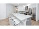 Contemporary kitchen boasts a large island, stainless steel appliances, and ample counter space at 3726 Rain Tree Ct, Palm Harbor, FL 34685