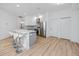 Spacious, updated kitchen featuring a large island with seating and stainless steel appliances at 3726 Rain Tree Ct, Palm Harbor, FL 34685