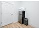 A small kitchenette area with a stacked microwave and refrigerator and storage at 3726 Rain Tree Ct, Palm Harbor, FL 34685