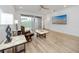 Comfortable living area with sliding glass doors and entertainment center at 3726 Rain Tree Ct, Palm Harbor, FL 34685