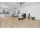 Open living area with modern furnishings and plenty of natural light at 3726 Rain Tree Ct, Palm Harbor, FL 34685