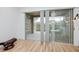 Enclosed patio with screened windows and outdoor seating area at 3726 Rain Tree Ct, Palm Harbor, FL 34685