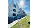 Exterior view of a townhome in the early stages of construction, showing scaffolding and block framework at 4723 W Price Ave # 2, Tampa, FL 33611