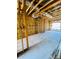 Unfinished room with exposed framing, insulation, and visible construction elements at 4723 W Price Ave # 2, Tampa, FL 33611