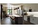 Modern kitchen featuring stainless steel appliances, a large island, and hardwood floors at 4723 W Price Ave # 2, Tampa, FL 33611