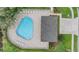 Aerial view of community pool, lounging area, and landscaping at 5116 Gato Del Sol Cir, Wesley Chapel, FL 33544