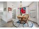 Charming dining area featuring wood floors, a round table and chairs, and a view of kitchen at 5116 Gato Del Sol Cir, Wesley Chapel, FL 33544