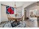 Bright dining room with a wooden table and chairs, enhanced by a colorful rug at 5116 Gato Del Sol Cir, Wesley Chapel, FL 33544
