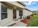 Welcoming front entryway with a decorative wreath and manicured landscaping at 5116 Gato Del Sol Cir, Wesley Chapel, FL 33544