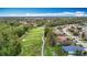 Aerial view of the community and lush backyard at 5526 Braddock Dr, Zephyrhills, FL 33541