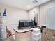 Finished basement space with a large desk, water heater, and ample room for storage at 5526 Braddock Dr, Zephyrhills, FL 33541