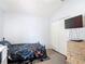 Comfortable bedroom featuring a closet, decorative dresser, and wood-look laminate flooring at 5526 Braddock Dr, Zephyrhills, FL 33541