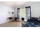 Well-lit bedroom with hardwood floors, gaming-themed bedding, and a window view at 5526 Braddock Dr, Zephyrhills, FL 33541
