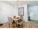 Cozy dining room shows decorative lighting fixture and adjacent access to the front entry at 5526 Braddock Dr, Zephyrhills, FL 33541
