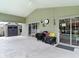 Covered patio space with ceiling fan, ideal for outdoor relaxation and dining at 5526 Braddock Dr, Zephyrhills, FL 33541