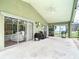 Outdoor patio features sliding glass doors and a view of the pool and backyard at 5526 Braddock Dr, Zephyrhills, FL 33541