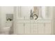 Bathroom featuring a double sink vanity and a toilet at 6849 E 115Th St, Palmetto, FL 34221