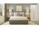 Bedroom featuring a queen bed, side tables, and a butterfly art piece at 6849 E 115Th St, Palmetto, FL 34221
