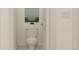 Clean powder room with a classic toilet, fresh paint, and simple decor at 6849 E 115Th St, Palmetto, FL 34221