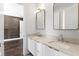 Bright bathroom with double sink vanity, quartz countertop and modern rectangular mirrors at 804 S Davis Blvd, Tampa, FL 33606