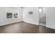 Bedroom featuring hardwood floors, neutral walls, large window and bright light at 804 S Davis Blvd, Tampa, FL 33606