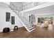 Stunning entryway featuring a modern staircase, high ceilings, and abundant natural light, creating an inviting atmosphere at 804 S Davis Blvd, Tampa, FL 33606
