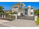 Modern two-story home with a gated driveway and black metal fence for added security at 804 S Davis Blvd, Tampa, FL 33606
