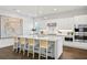 Elegant kitchen with a large island, modern lighting, and stylish seating for a contemporary design at 804 S Davis Blvd, Tampa, FL 33606