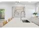 Bright, modern kitchen featuring a large island, stylish seating, and contemporary artwork at 804 S Davis Blvd, Tampa, FL 33606
