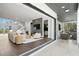 Open-concept living area with modern fireplace and seamless indoor-outdoor transition at 804 S Davis Blvd, Tampa, FL 33606