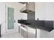 This outdoor kitchen features stainless steel appliances, sleek countertops, and a modern design at 804 S Davis Blvd, Tampa, FL 33606