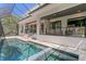The backyard includes a beautiful swimming pool, a spa, outdoor seating and an outdoor kitchen at 804 S Davis Blvd, Tampa, FL 33606