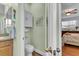 Bathroom featuring tiled floors, modern fixtures, and bedroom access at 8202 Pinewood Run Ct, Tampa, FL 33647