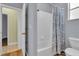 Bathroom features a tub and shower combination with white tile and neutral walls at 8202 Pinewood Run Ct, Tampa, FL 33647