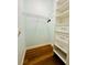 Walk-in closet with a wire shelf, drawers, and plenty of storage; wood-look floor at 8202 Pinewood Run Ct, Tampa, FL 33647