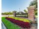 Attractive brick community sign, 'The Preserve', framed with colorful flowers and landscaping at 8202 Pinewood Run Ct, Tampa, FL 33647