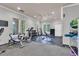 Bright community gym with a variety of exercise equipment including weights, stationary bikes, and benches at 8202 Pinewood Run Ct, Tampa, FL 33647