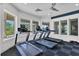 Modern gym featuring state-of-the-art treadmills, large windows, and a clean, well-maintained workout space at 8202 Pinewood Run Ct, Tampa, FL 33647