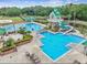 Large community pool with waterslide, lap pool, tower, and plenty of seating at 8202 Pinewood Run Ct, Tampa, FL 33647