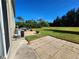 An outdoor patio overlooking a large yard and landscaping, perfect for entertaining or relaxing at 8796 Christie Dr, Largo, FL 33771