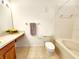 Bathroom with tile flooring, shower/tub combo, neutral walls, and a wood vanity with countertop space at 8796 Christie Dr, Largo, FL 33771