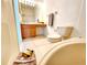 Bathroom featuring a soaking tub, wooden cabinetry, a vanity area, and tile flooring at 8796 Christie Dr, Largo, FL 33771