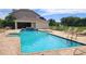 Resort-style pool area with a pool, sun loungers, and a covered pavilion for relaxing at 8796 Christie Dr, Largo, FL 33771