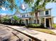 Charming townhome featuring a well-maintained facade with lush landscaping and ample parking at 8796 Christie Dr, Largo, FL 33771