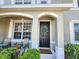 Charming front porch with seating, a decorative wreath, and a welcoming front door at 8796 Christie Dr, Largo, FL 33771