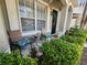 Inviting front porch with seating and lush landscaping enhancing curb appeal at 8796 Christie Dr, Largo, FL 33771