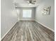 Spacious living area with modern flooring, neutral walls, and a bright, open layout at 8796 Christie Dr, Largo, FL 33771