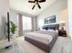 Bright main bedroom with a large bed, window, and modern decor creating a relaxing and stylish retreat at 8796 Christie Dr, Largo, FL 33771