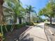 Well-maintained condo building with lush landscaping and ample parking spaces for residents and guests at 8796 Christie Dr, Largo, FL 33771